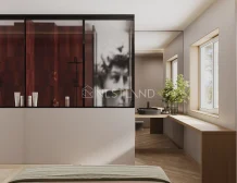 A modern bedroom with a red wardrobe, a blurry artwork, and a window-side vanity.