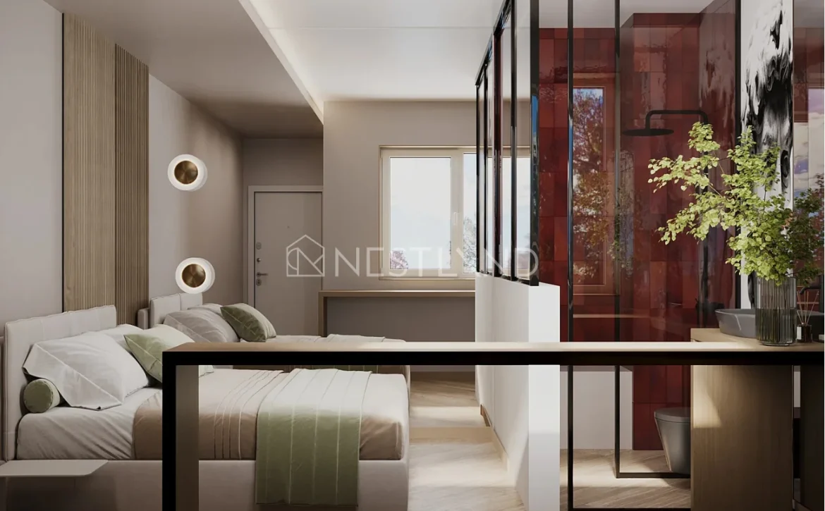 Modern bedroom with beige accent wall, stylish bed, and glass room divider.