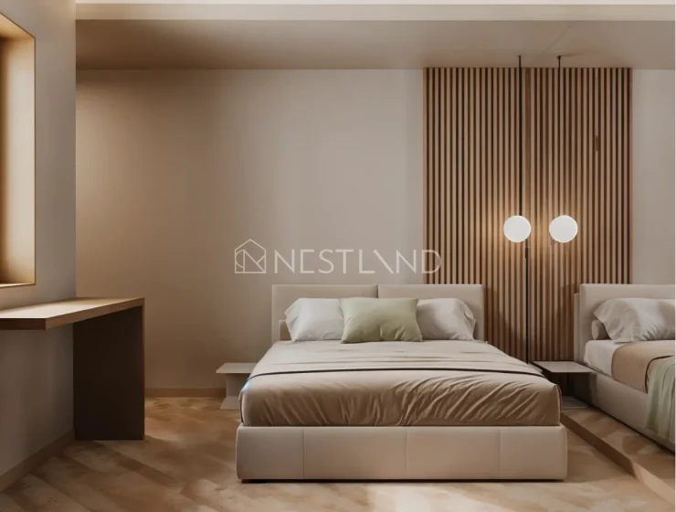 Modern bedroom with a large bed, wooden accents, and soft lighting.
