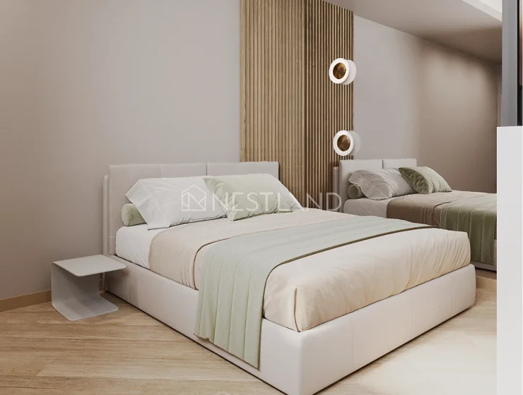 Modern bedroom with a double bed, wooden paneling, and round wall lamps.