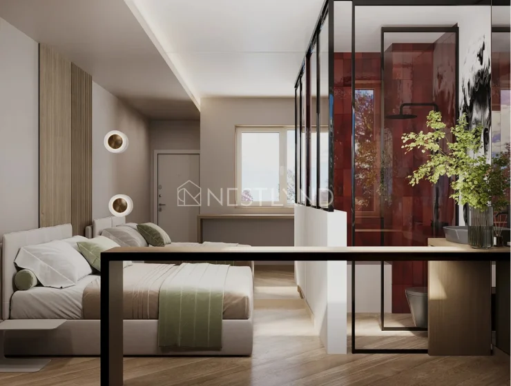 Modern bedroom with beige accent wall, stylish bed, and glass room divider.