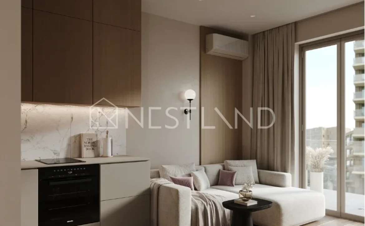 Modern living room with a kitchenette, sofa, and balcony access, natural light, wooden accents.