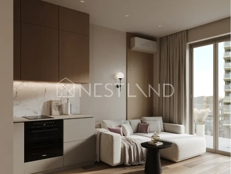 Modern living room with a kitchenette, sofa, and balcony access, natural light, wooden accents.