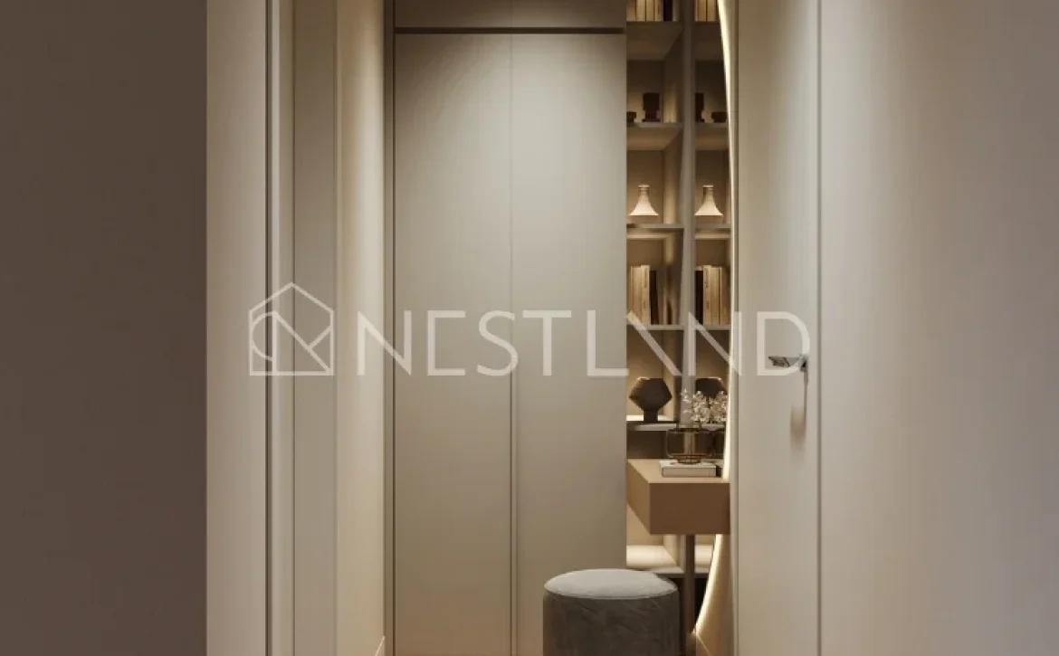 Modern hallway with herringbone wood flooring, built-in cabinets, and a cozy nook with a shelf and stool.