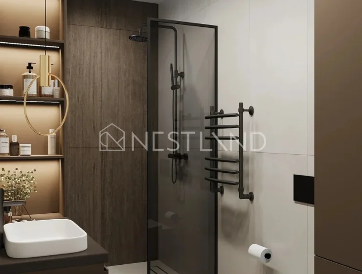 Modern bathroom with glass shower, wooden accents, and wall-mounted sink and toilet.